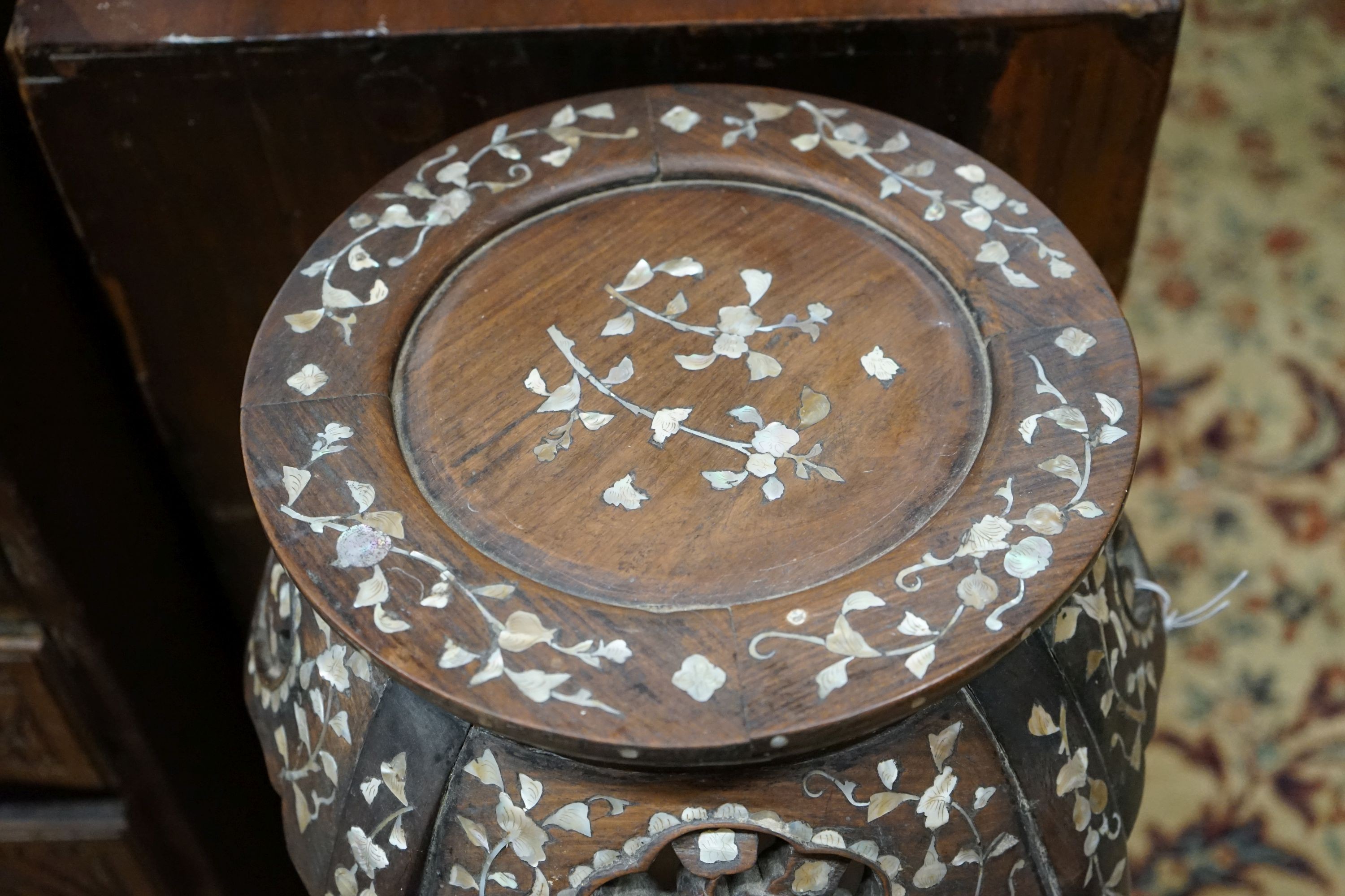 A pair of Chinese mother of pearl inset hardwood vase stands, height 92cm